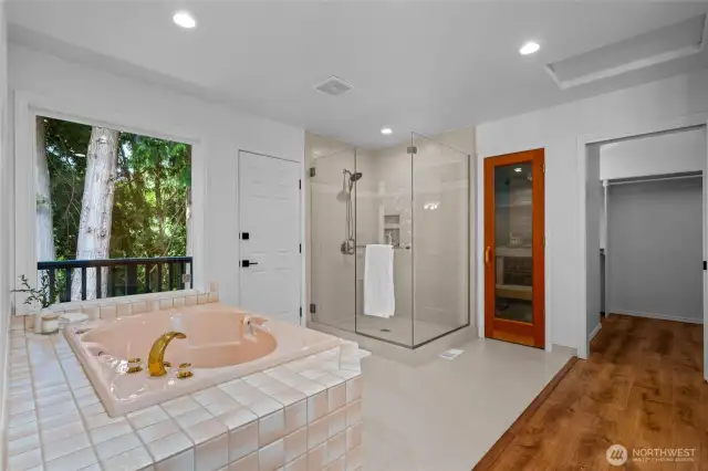 Cedar sauna, walk-in shower, and oversized soaking tub offer true retreat vibes in the primary bath.