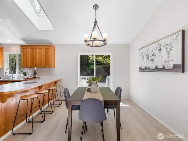 Open to the living room, the dining area is perfectly positioned to catch the light and enjoy views of the trees beyond. Whether it’s a casual weeknight meal or a holiday gathering, this space adapts with ease.