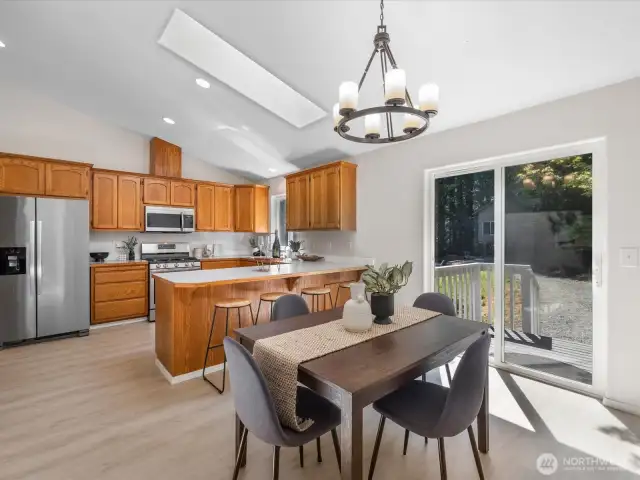 The kitchen is open to the dining room and offers easy access to the backyard—ideal for indoor-outdoor living.