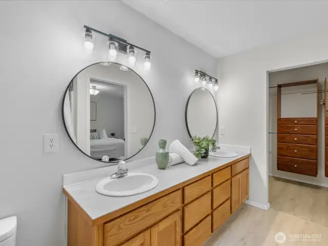 Completely refreshed with modern fixtures and finishes, the ensuite bath offers a calming, spa-like experience with a sleek vanity, updated lighting, and a clean, functional layout.