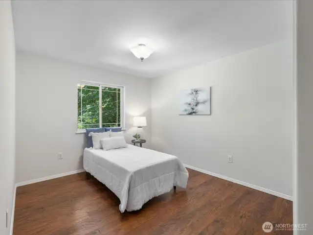 Another generously sized room with lake views, fresh flooring, and endless possibilities for layout and use. Whether it's for siblings sharing a space or a dedicated playroom, this room is as flexible as it is charming.