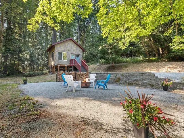 Whether you're gardening, hosting a summer BBQ, or simply unwinding with a cup of coffee in the morning sun, this yard is made for it all.