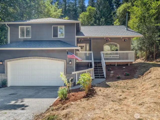 Front of the home. Freshly painted exterior and new garage door.