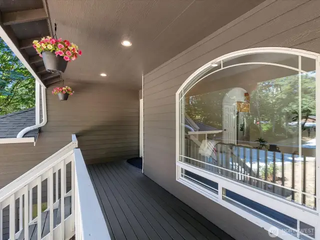 Freshly painted exterior includes front deck and railing.