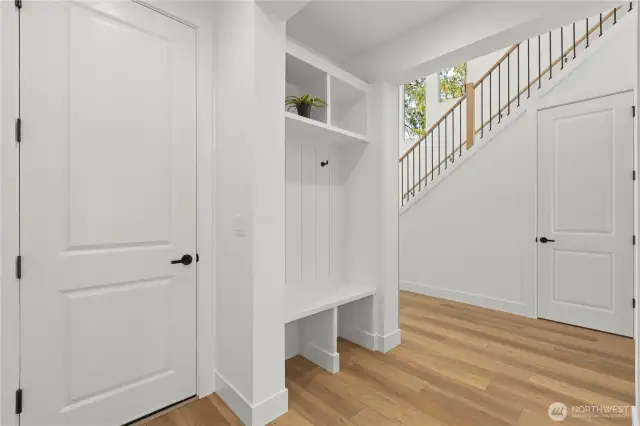 Custom built in bench/storage right off garage.