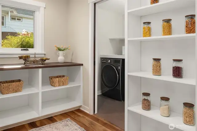 Large walk-in pantry w/ washer and dryer around the corner