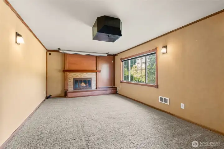 Lower level family room with wood fireplace.