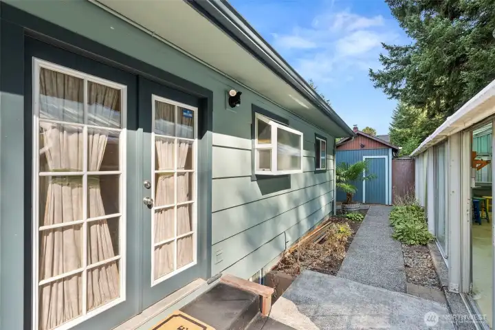 French doors open to patio and back yard.