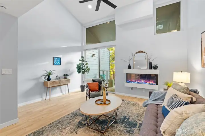Spacious living room with fan to keep you cool.