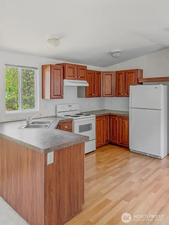 Ample storage and workspace make this kitchen as practical as it is welcoming.