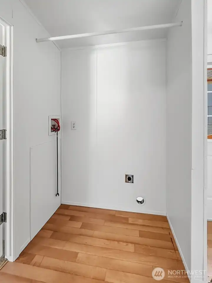 Laundry nook ready for your washer and dryer with added utility storage.