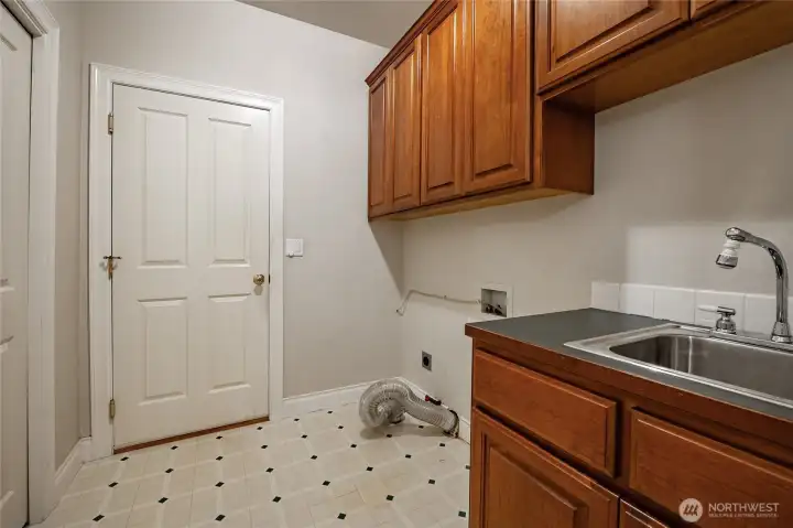 Laundry room leads into the 2 car garage.