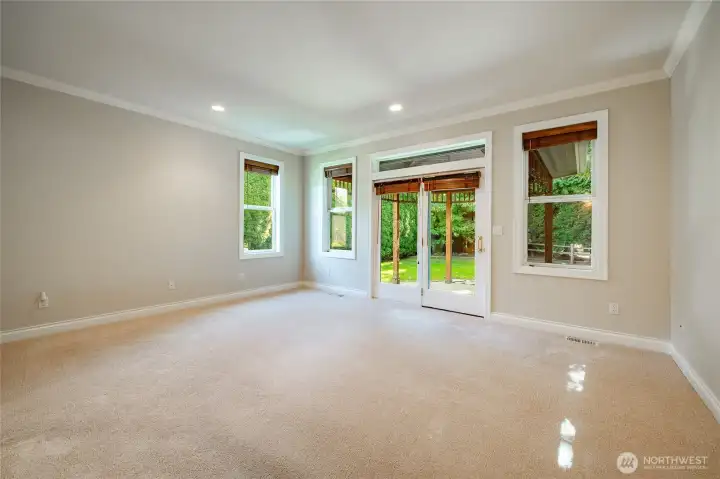 Large Primary Bedroom with a door to the covered patio. En-suite and walk-in closet