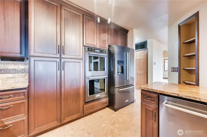 Two large pantry cabinets with slide-outs as well as the double oven!