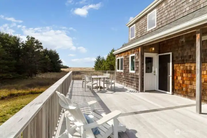 The beautiful Ipe hardwood deck welcomes you to the front entry and wraps around the home for durable indoor-outdoor living.