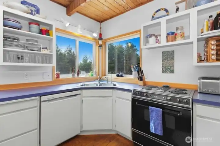 Enjoy natural light while working at the kitchen sink with windows facing south and west.