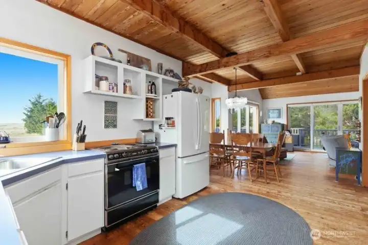 Open-concept design connects the kitchen, dining area, and great room—perfect for relaxed gatherings.