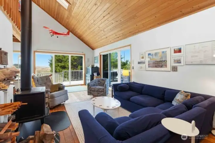 Cozy living room centered around a woodstove—ideal for warming up after a day hiking, biking or exploring.