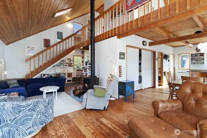 Scandinavian-inspired design with an open loft above creates a bright, spacious great room.