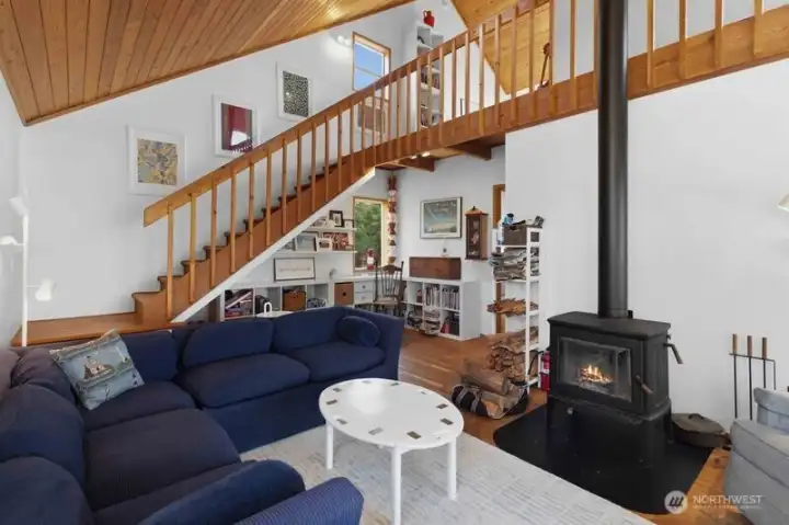 Recent updates include the EPA-certified high efficiency wood stove, newer roof, well pump with water treatment system, bathroom fixtures, plumbing.