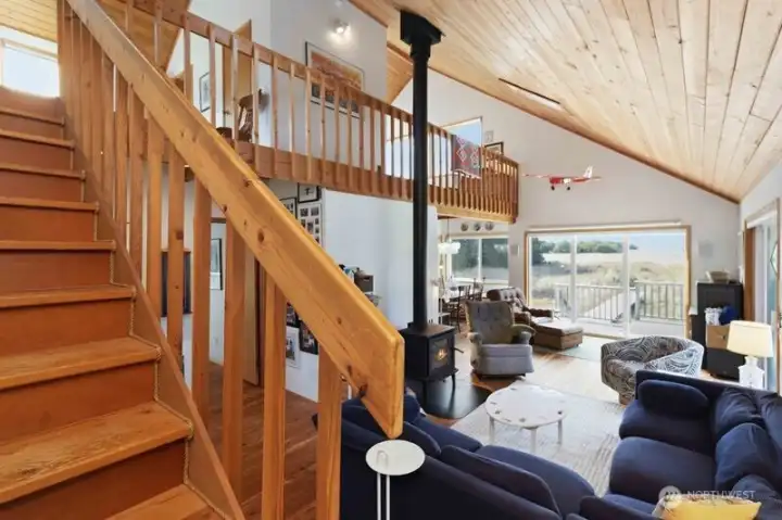 Stairway leads to the loft sleeping areas with elevated views of the surrounding landscape.