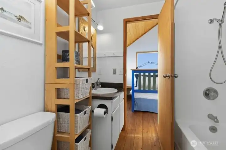 Full bathroom conveniently located between the two loft sleeping areas.