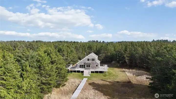 2.5 acres (and growing) provides rare privacy and space along this peaceful stretch of coastline.