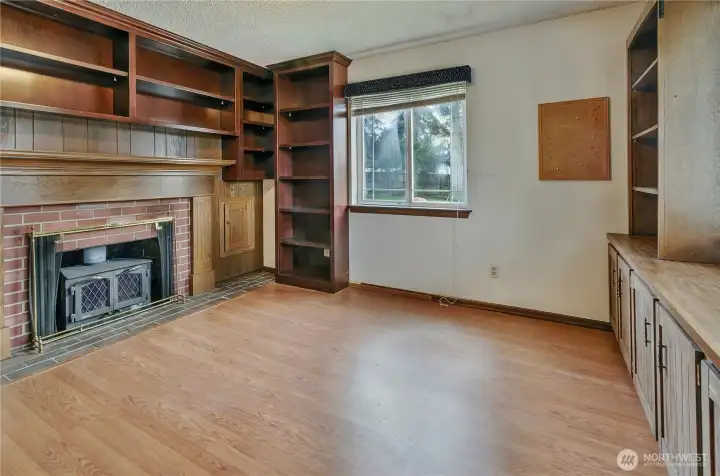Den/Office/Work Area With Fireplace And Built In Cabinets