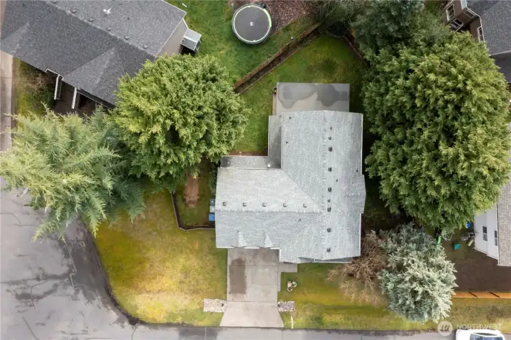 Aerial view of this third acre fully fenced lot with lots of privacy and extra parking