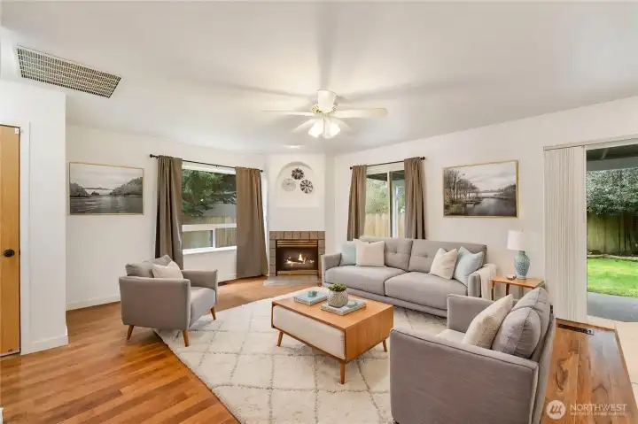 Here is virtually staged second living family room at back of home with built in gas fireplace with ceiling fans to move heat and cool air around.  Family room is just off open kitching area and patio for lots of fun