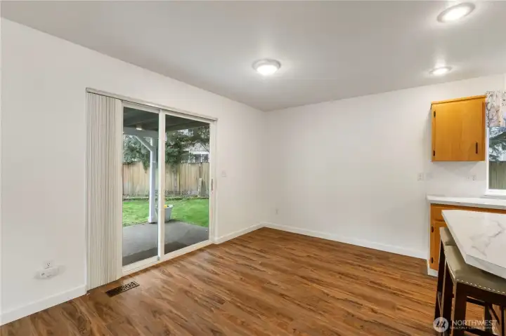 Second eating area off kitchen leading to covered patio