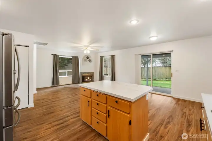 Kitchen island with lots of storage under counters and view to back yard