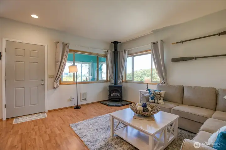Spacious living room with propane free standing stove