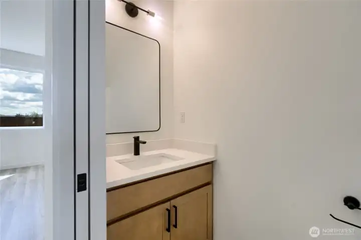 1/2 bath on main level.  Photos are of a different unit.