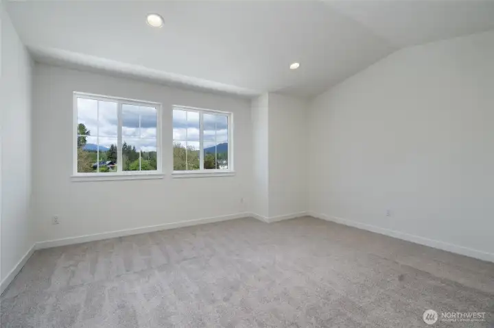 The primary bedroom. Picture of a different duplex.