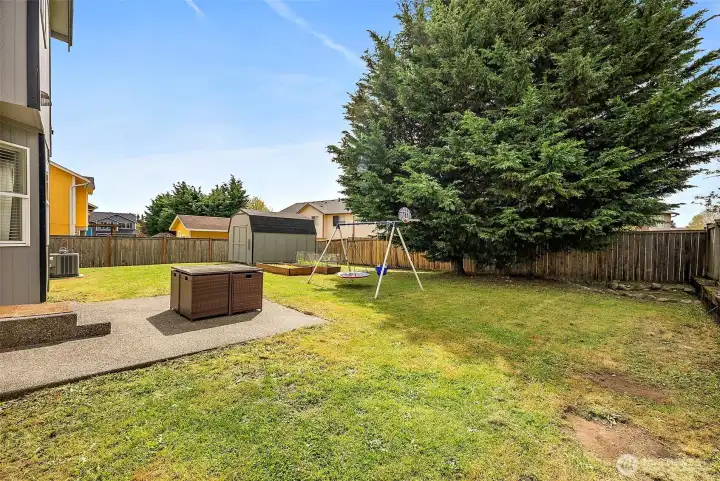 Large, level, fully fenced back yard.