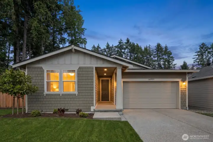 Built in 2023 in Puyallup's Emerald Hollow community, this single-story home offers the ease of newer construction with a welcoming exterior, attached 2-car garage, and thoughtfully designed layout.