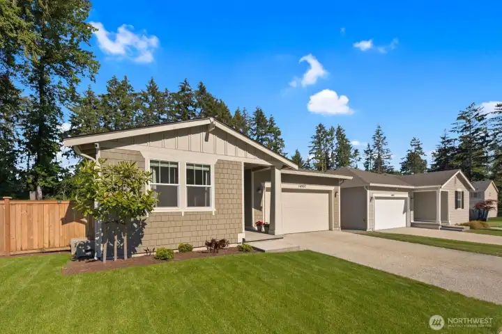 A clean, modern exterior and low-maintenance design set the tone for this 3-bedroom, 1.75-bath home in one of Puyallup's established newer communities.