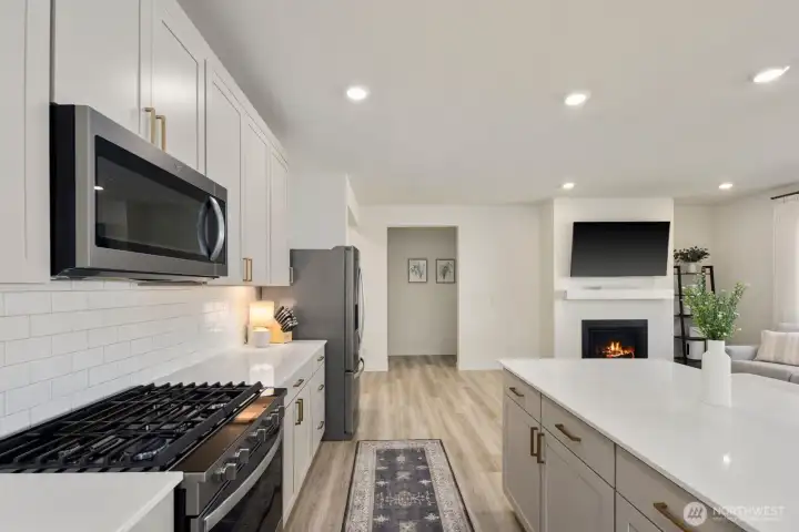 The kitchen remains connected to the main living spaces, allowing conversations and gatherings to flow naturally throughout the home.