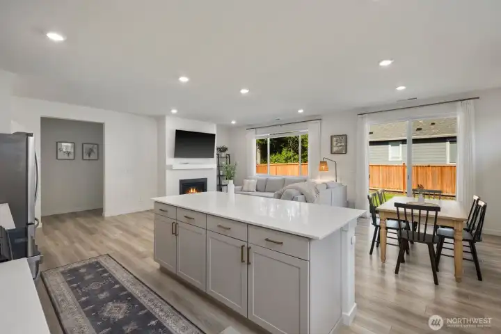From meal prep to movie nights, the open-concept design keeps the kitchen, dining area, and great room working together as one cohesive living space.