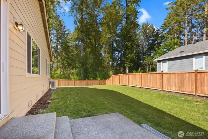 Step outside to a fully fenced backyard with room to relax, play, garden, or simply enjoy the peaceful setting behind the home.