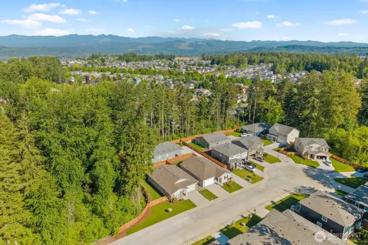 Tucked into a quiet neighborhood and bordered by mature trees, this location offers a unique blend of community living and natural surroundings.
