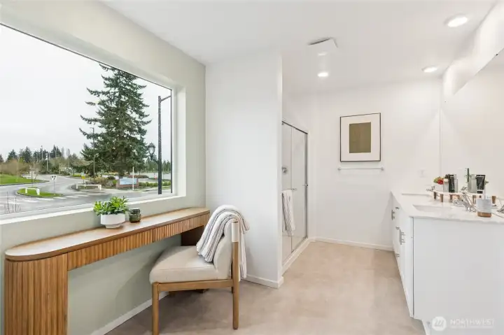 Well-appointed primary bathroom with wonderful natural light.