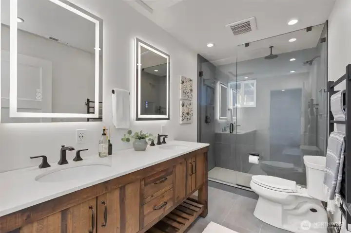 3/4 bath with 2 sink vanity and glass encased shower. 3/4 bath with 2 sink vanity and glass encased shower.