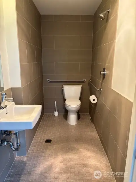 ground floor commercial space bathroom. Does have a shower plumbed.