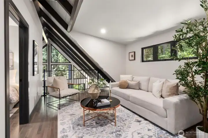 Just above, the architectural journey continues with an upstairs lofted bonus space. Elevated yet connected, this versatile sanctuary is ideal for a sunlit home office, private library, fitness studio, or your own dedicated yoga and meditation retreat.