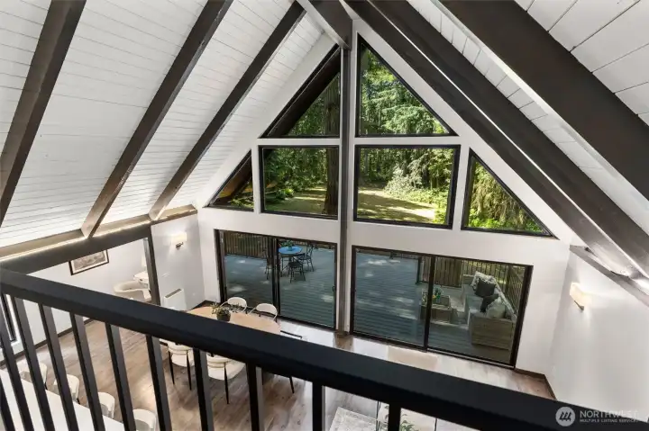 Just above, the architectural journey continues with an upstairs lofted bonus space. Elevated yet connected, this versatile sanctuary is ideal for a sunlit home office, private library, fitness studio, or your own dedicated yoga and meditation retreat.