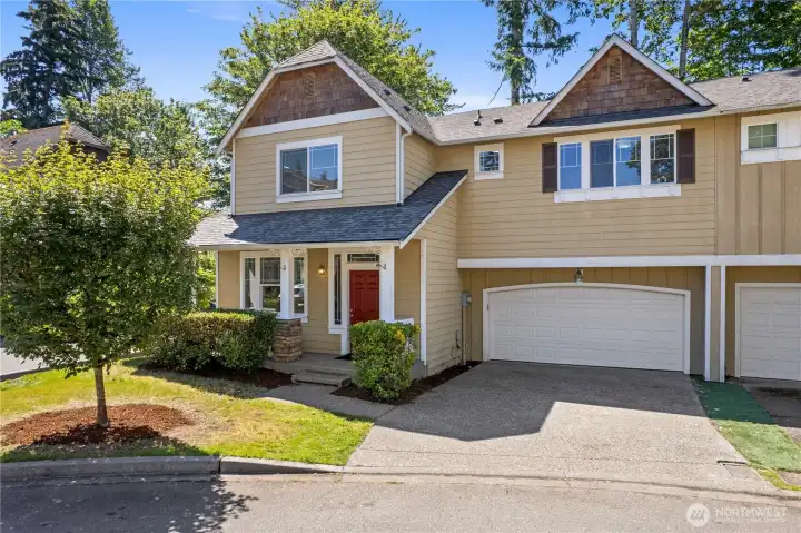 Classic Craftsman curb appeal with a 2-car garage and manicured landscaping that gives great first impression from the street.