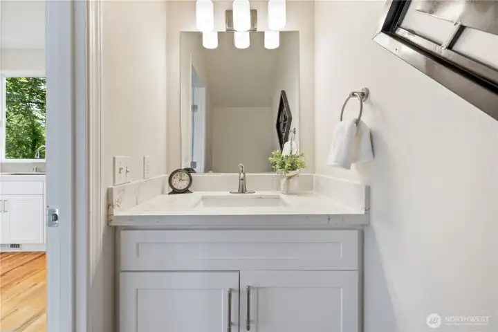 Updated bathroom vanity with clean cabinetry and modern fixtures.