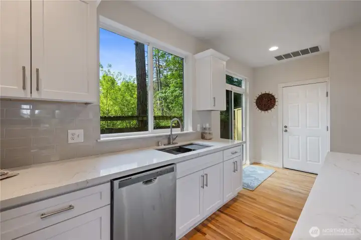 Kitchen from another angle showing the window over the sink — great natural light while doing dishes